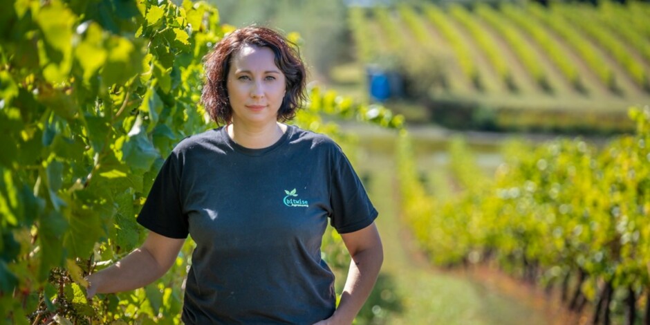 Fiona Turner standing in vineyard grapes
