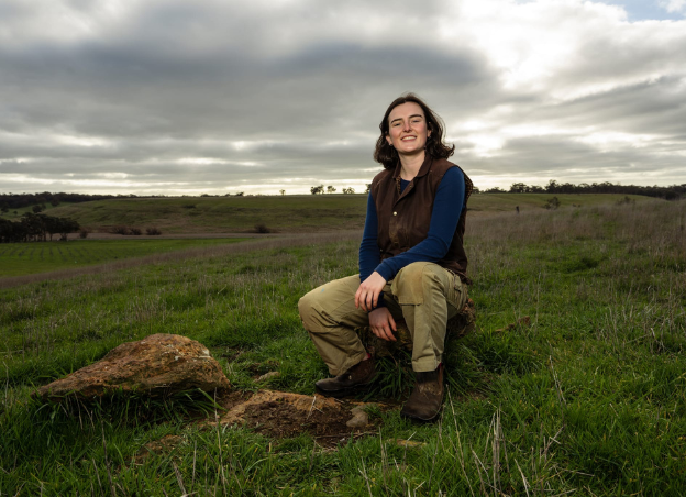 Future Young Leader Amy Ferguson on a rock at home in a paddock